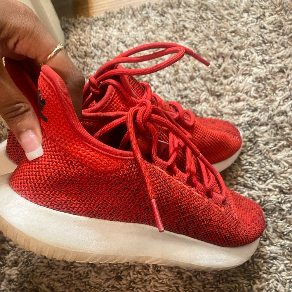 Red adidas tubular shadow